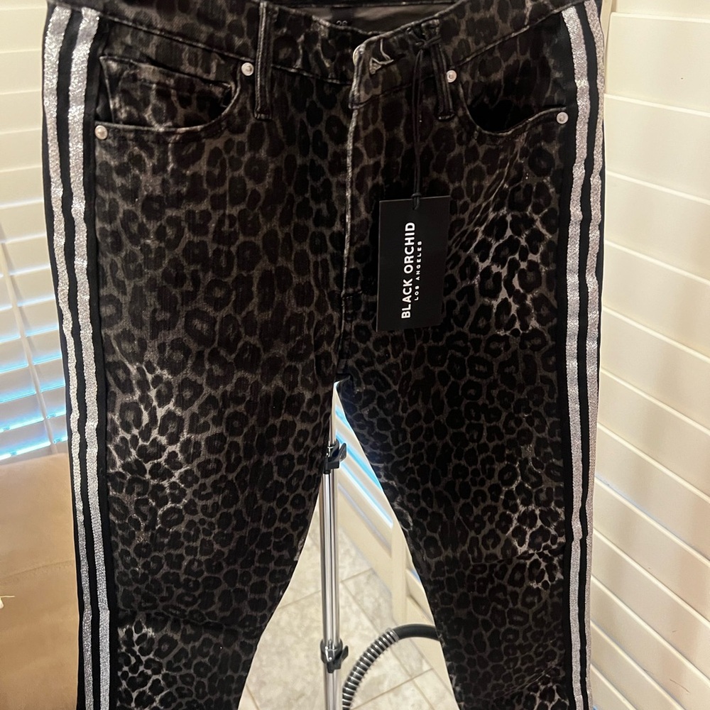 Make a statement in these one of a kind NWT Black Orchid Jeans.